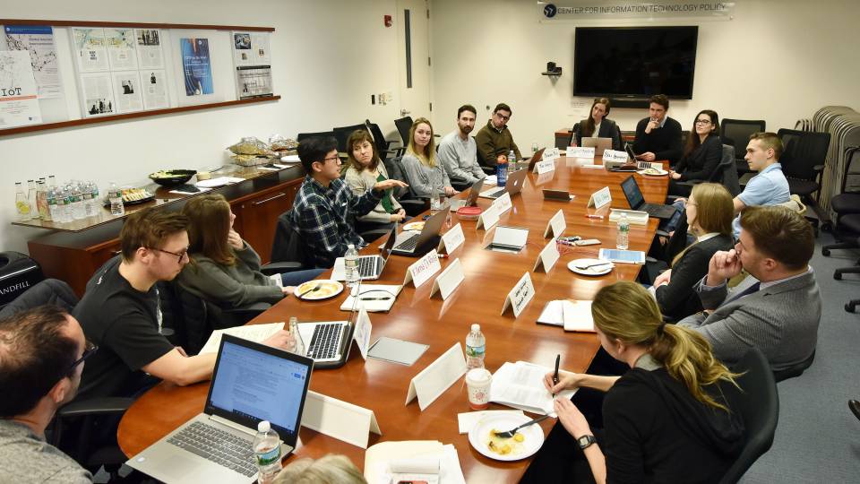 Graduate students talk in the Ethics of AI meeting