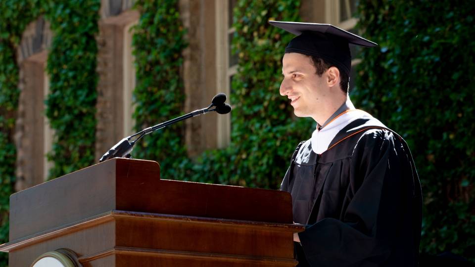 Rafail Zoulis gives his address at the podium