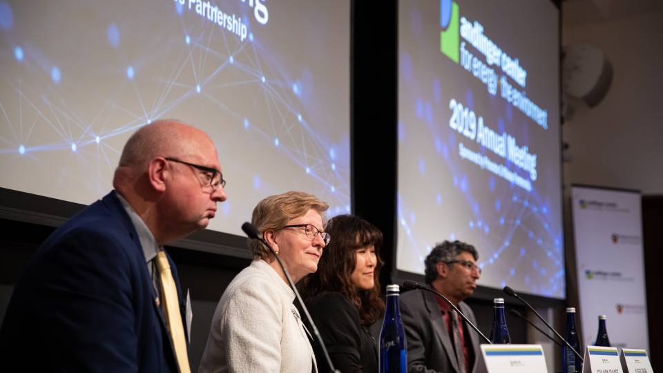 4 people sit at a table