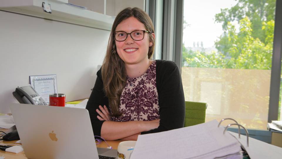 Leslie Schoop works at her computer