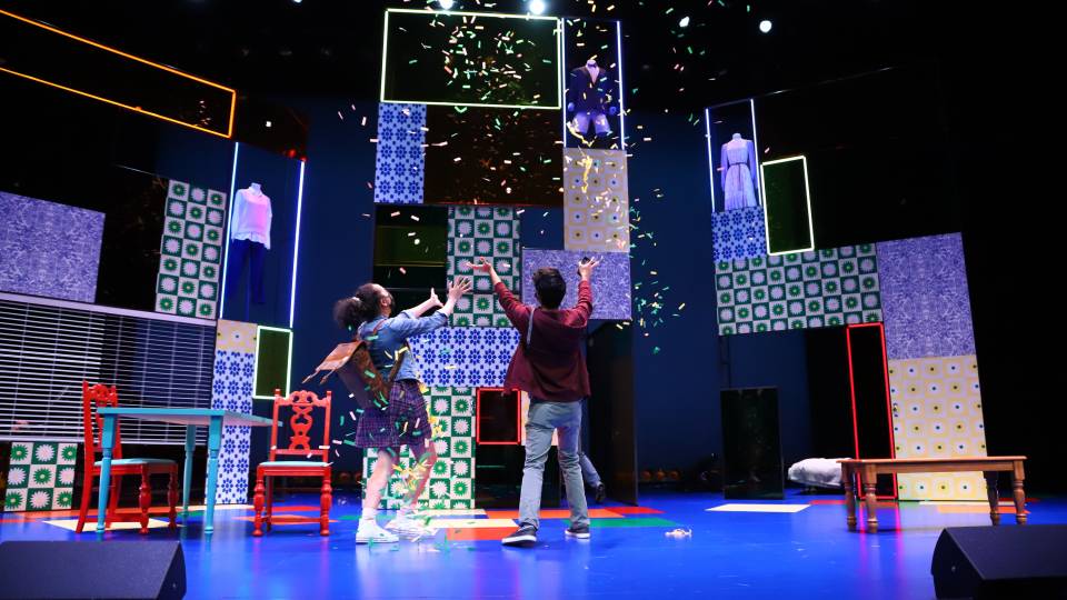 Two characters throw confetti