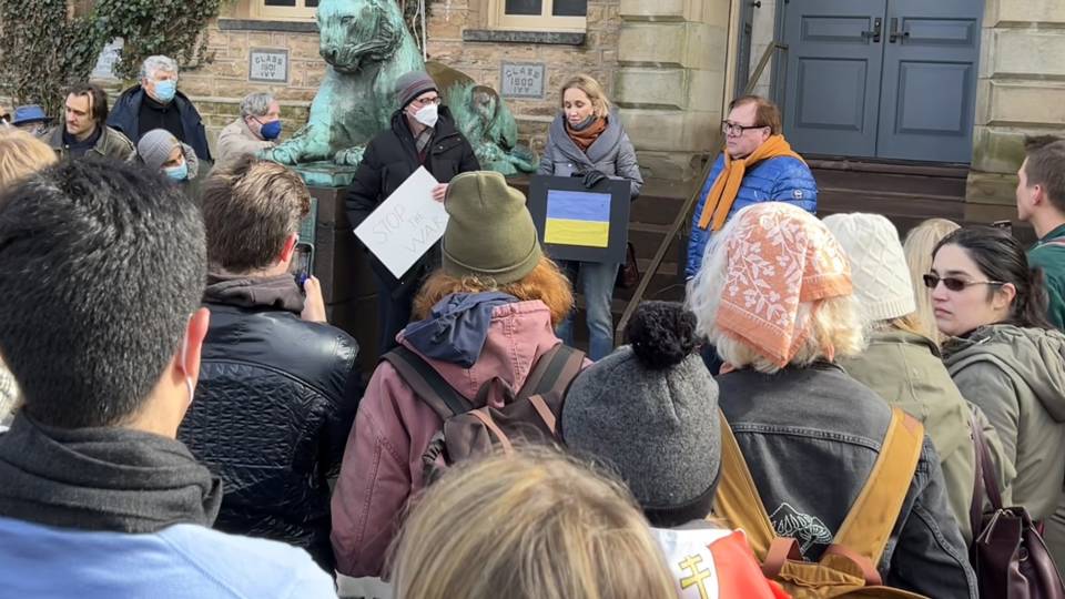 People at a rally in front of Nassau Hall