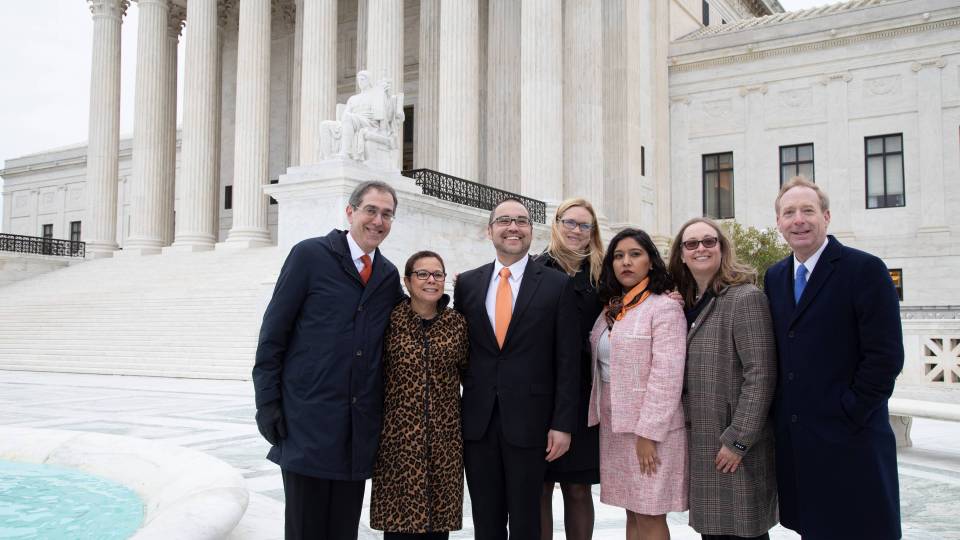 Group standing on courthouse steps