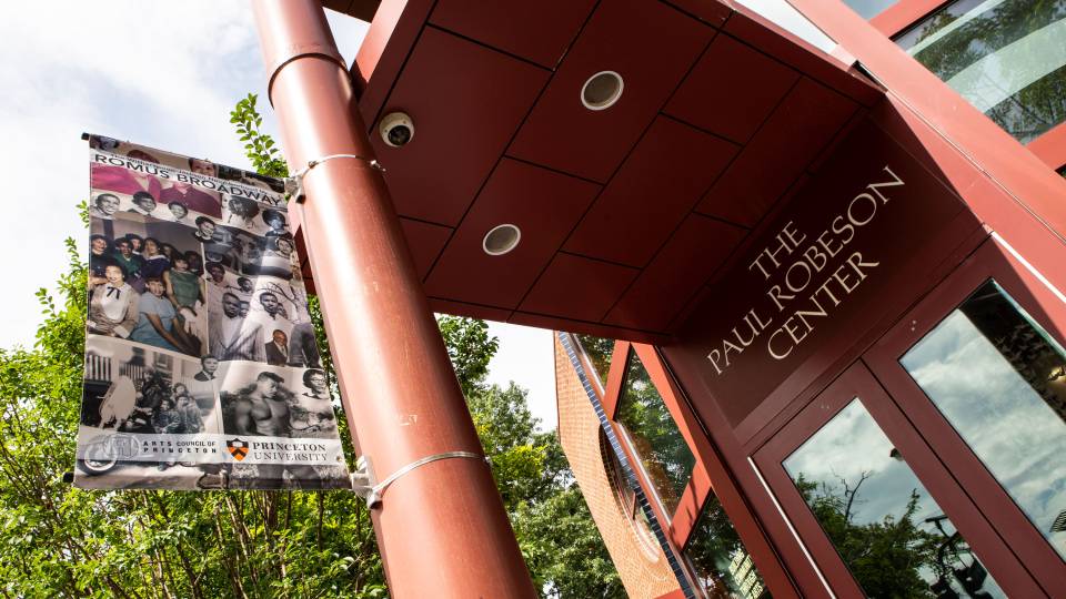 a banner advetising the Romus Broadway exhibit outside the Paul Robeson Center