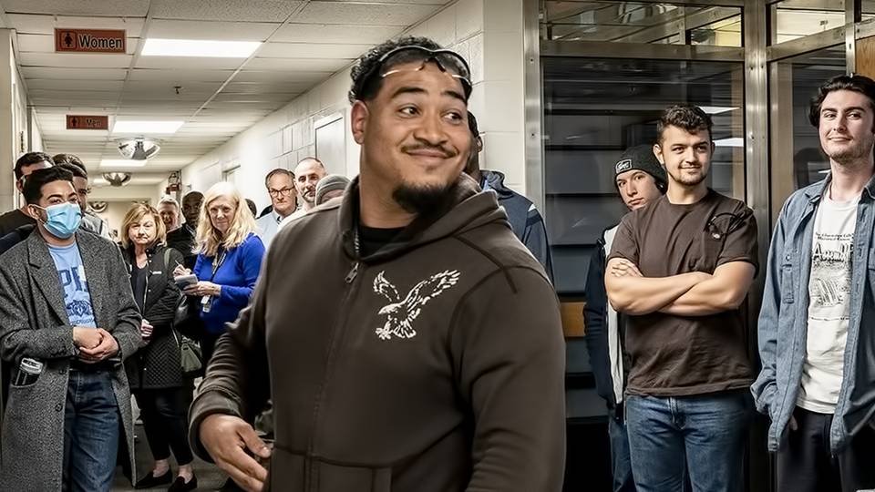 Steve Armstrong, an HVAC apprentice, center, and other apprentices outside the Computer Center.