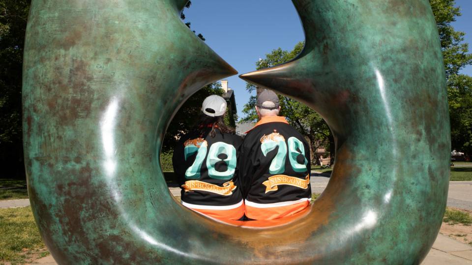 Two Princeton alumni wearing their class jacket