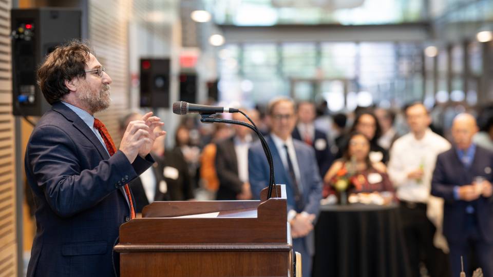 Princeton's vice dean for innovation at a podium addressing a crowd.