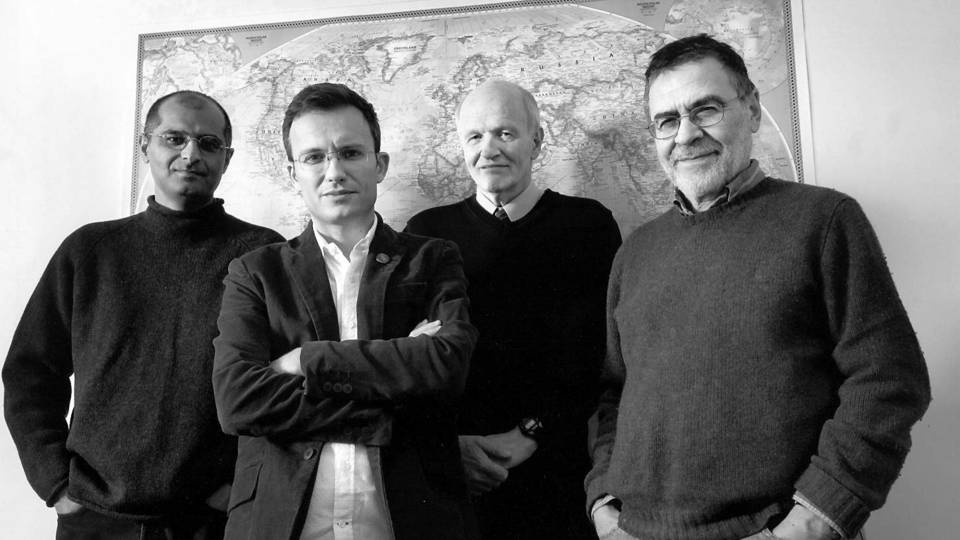 The four current and former co-directors of Princeton's Program on Science and Global Security stand together in front of a map and represent 50 years of nuclear policymaking at Princeton.