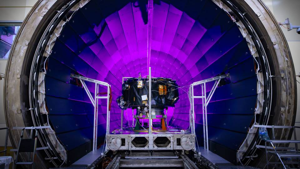 The IMAP instrument is loaded into a massive chamber.