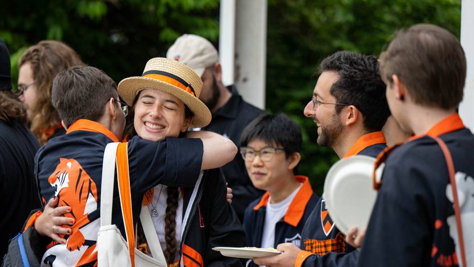 Princeton alumni hug each other