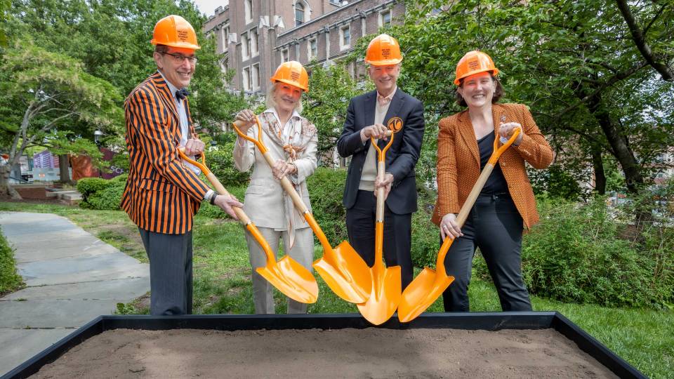 President Eisgruber, the Schmidts and Provost Rexford in hard hats with ceremonial shovels