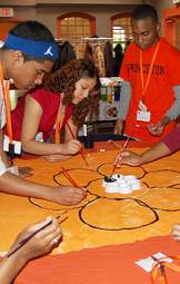 Rashá Harvey (right), a Princeton Prize winner from Nashville, and other students participate in an art workshop.