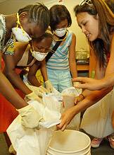 Mixing clay and sawdust