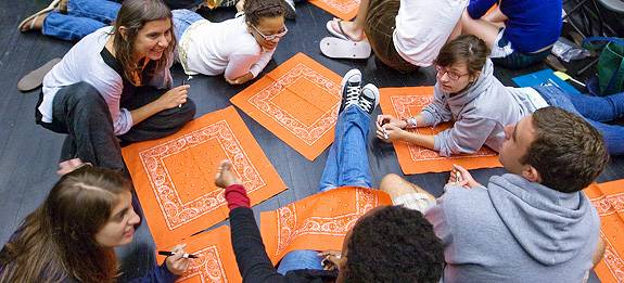 circle of students with handkerchiefs