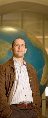 Shapiro in front of globe