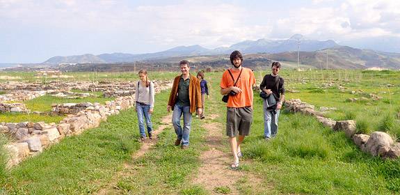 students walking among ruins