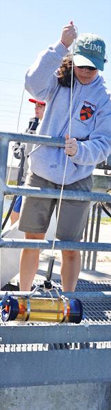 Student collecting water samples