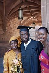 student with family in arch