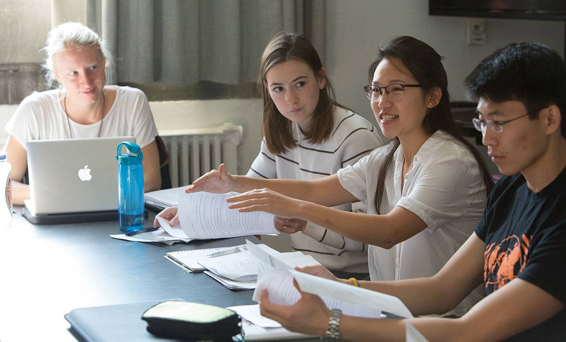 Senior Zoe Sims, junior Fiona Furnari, senior Catherine Niu and senior Jason Choe workshop personal essays in class Writing the Environment Through Creative Nonfiction.