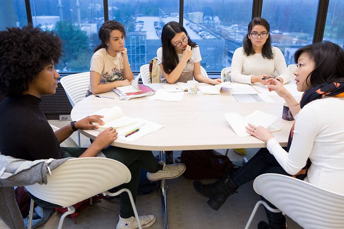 Monica Youn, a lecturer in creative writing and the Lewis Center for the Arts (left) engages students in a discussion during the course ‘Special Topics in Poetry: Race, Identity and Innovation.’