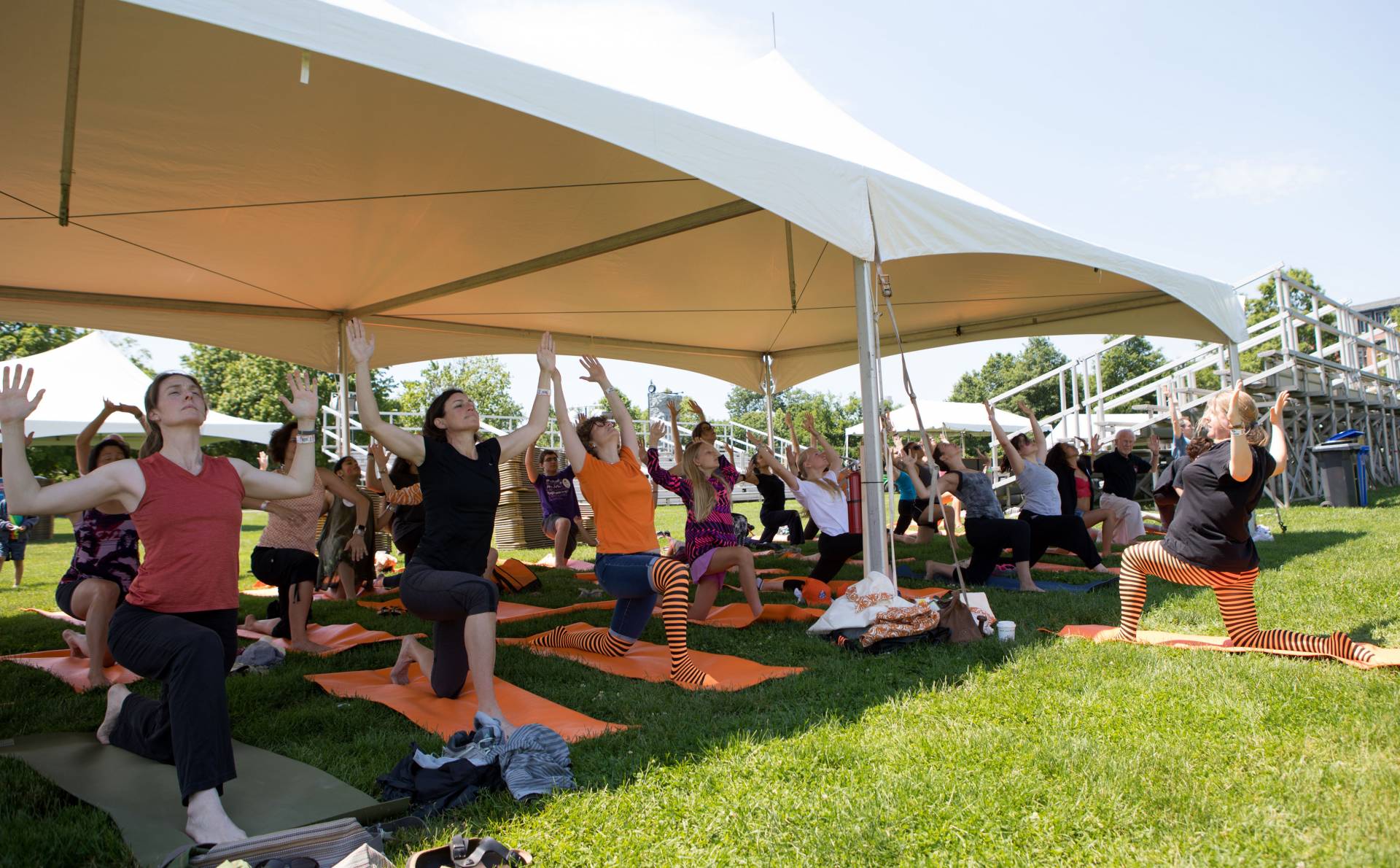 Alumni doing yoga at Poe Field