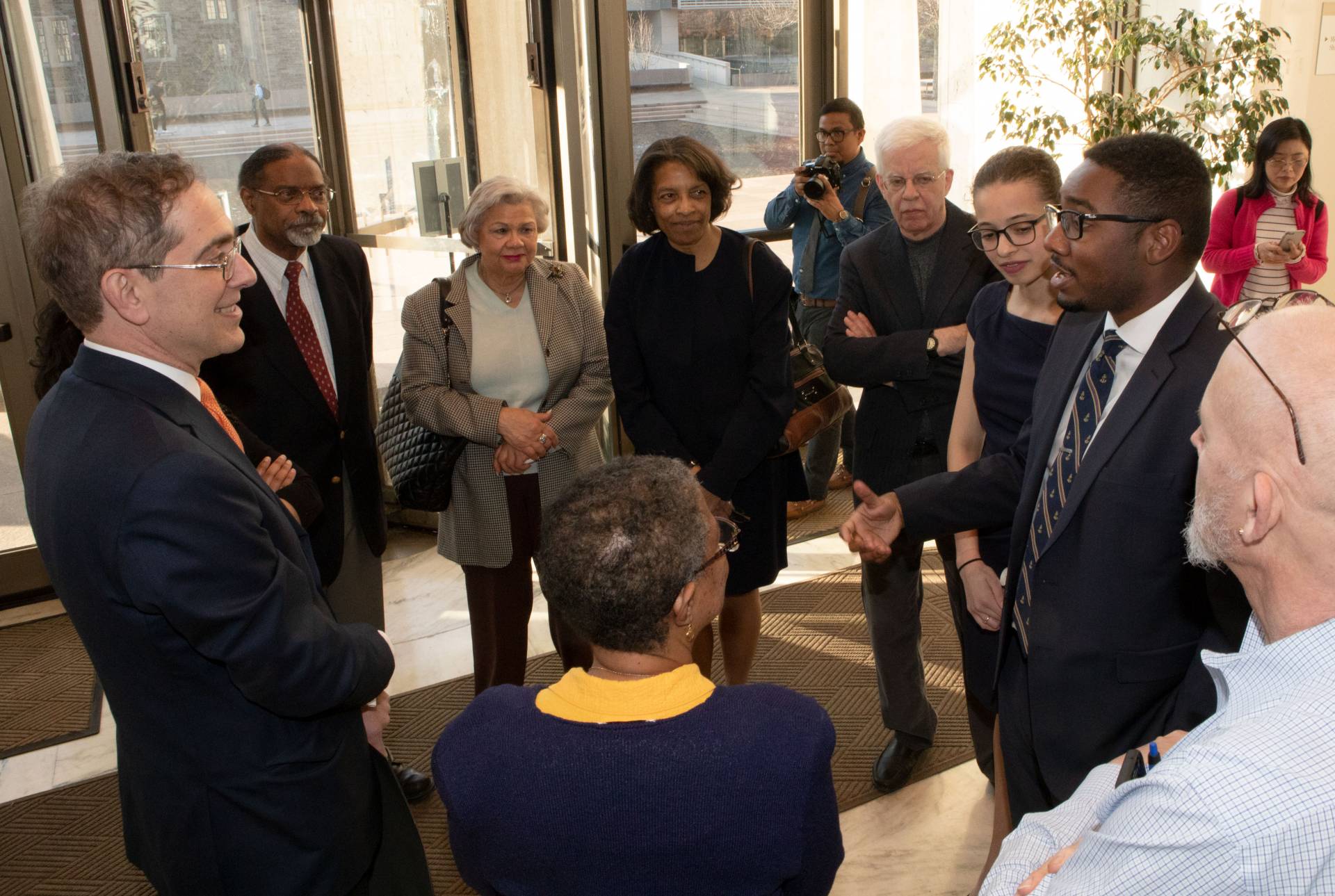 President Eisgruber speaking with Arthur Lewis family members