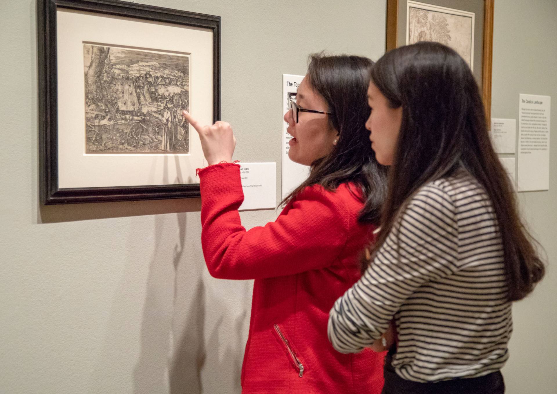Sarah Cho and Sarah Rapoport look at work by Albrecht Durer