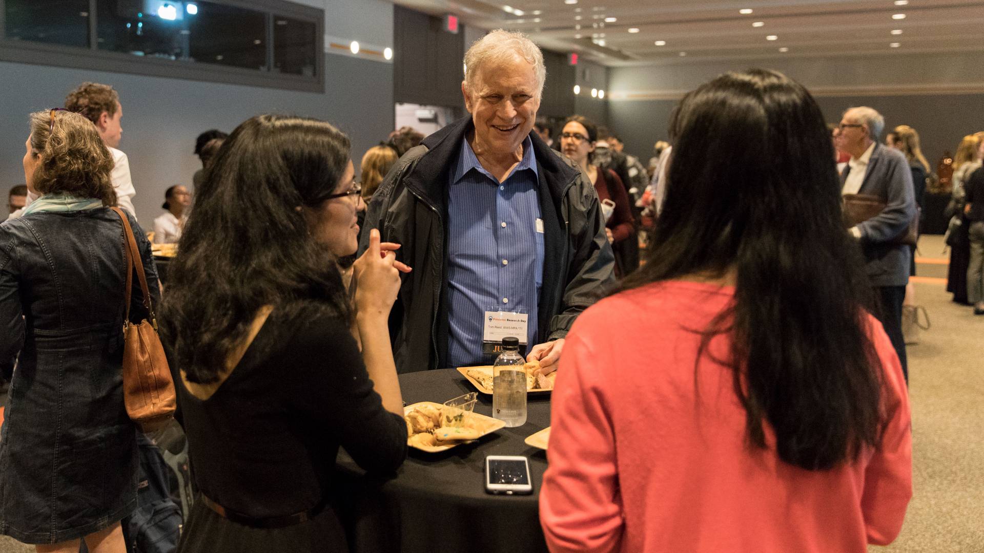 Attendees chatting at Princeton Research Day reception