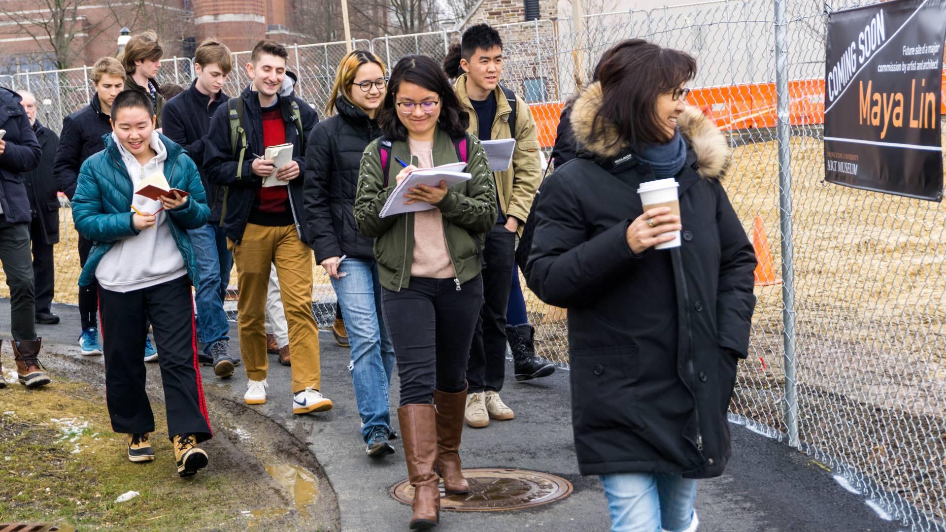 Maya Lin walking with students at Lewis Arts complex