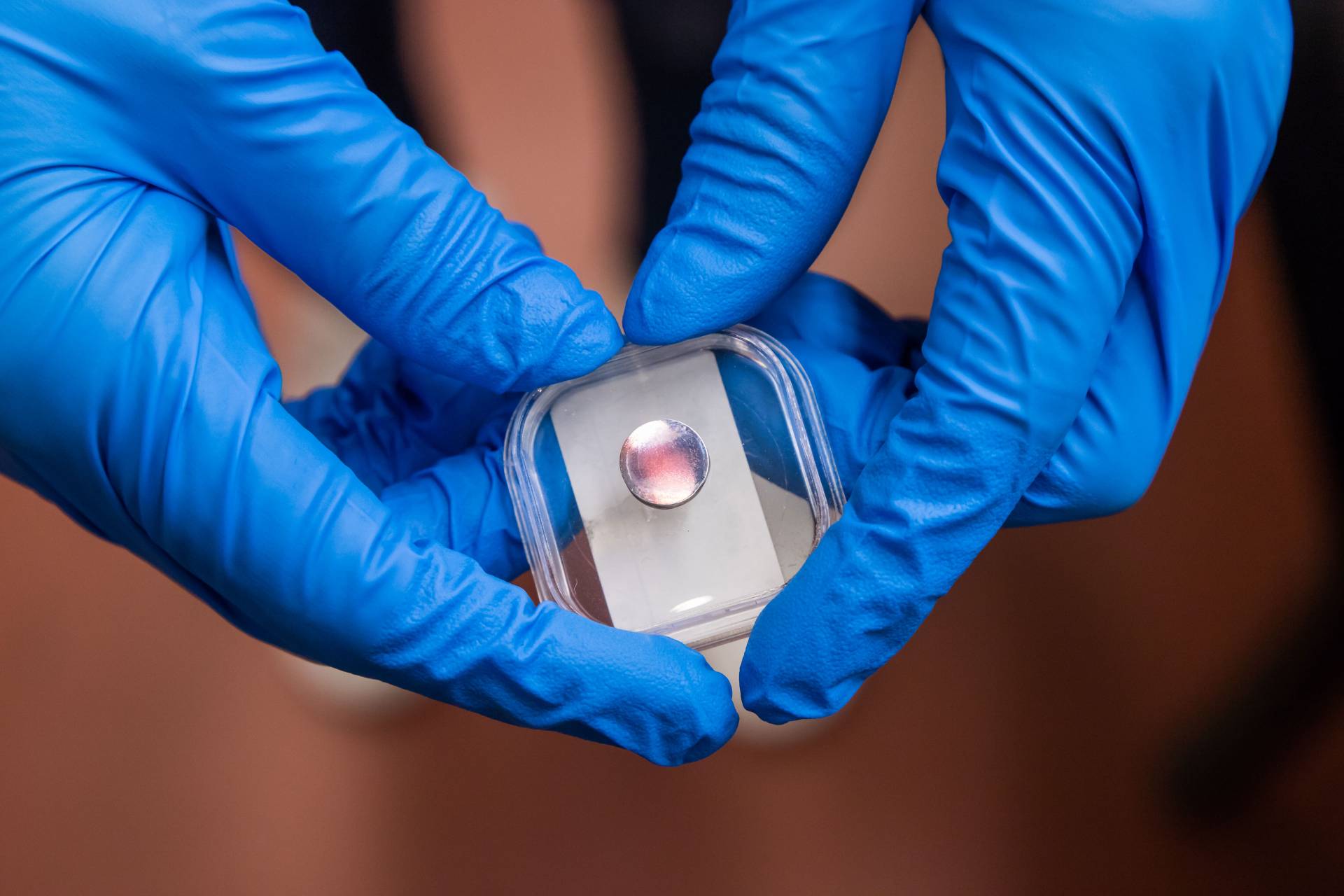 Hands holding tungsten