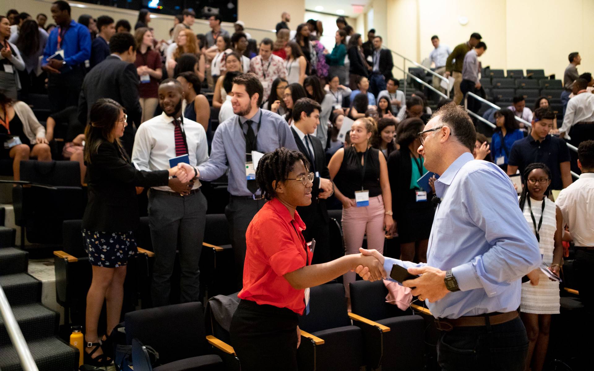 Students practicing handshakes in LEDA summer program