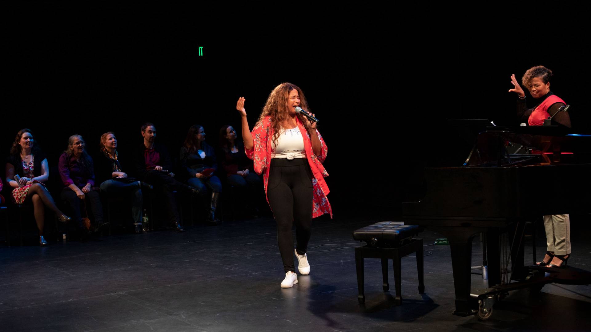 Kwanza Jones and Meta Jones giving a spoken word performance