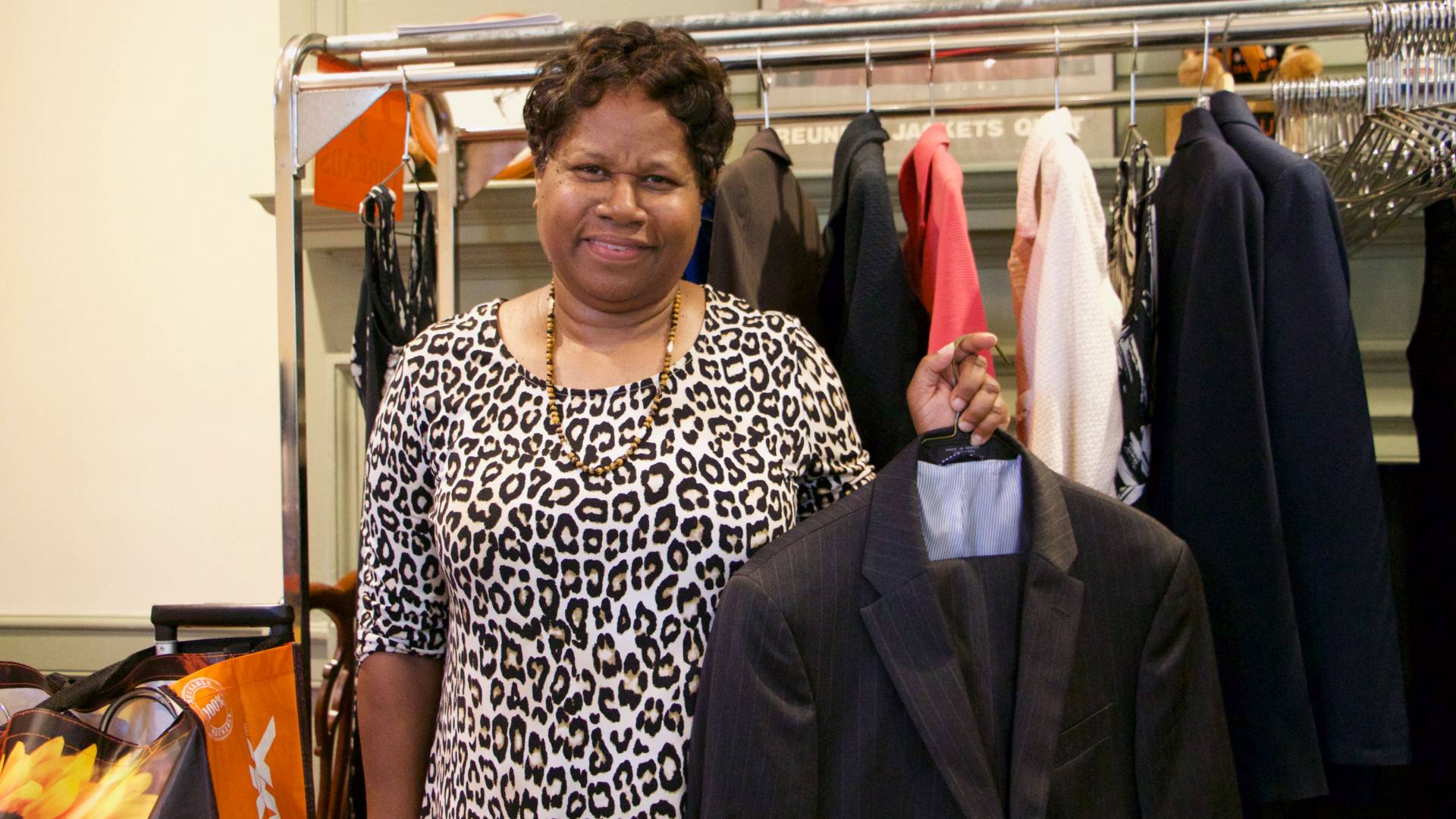 Karen Ali holding suit jacket