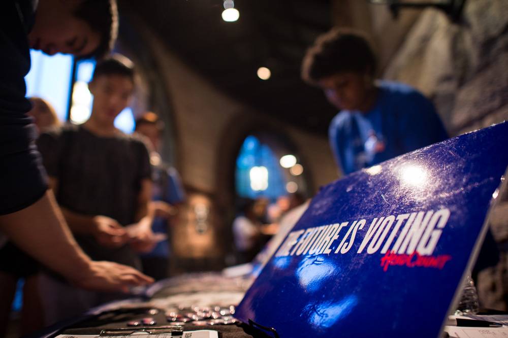 Vote 100 kiosk with students