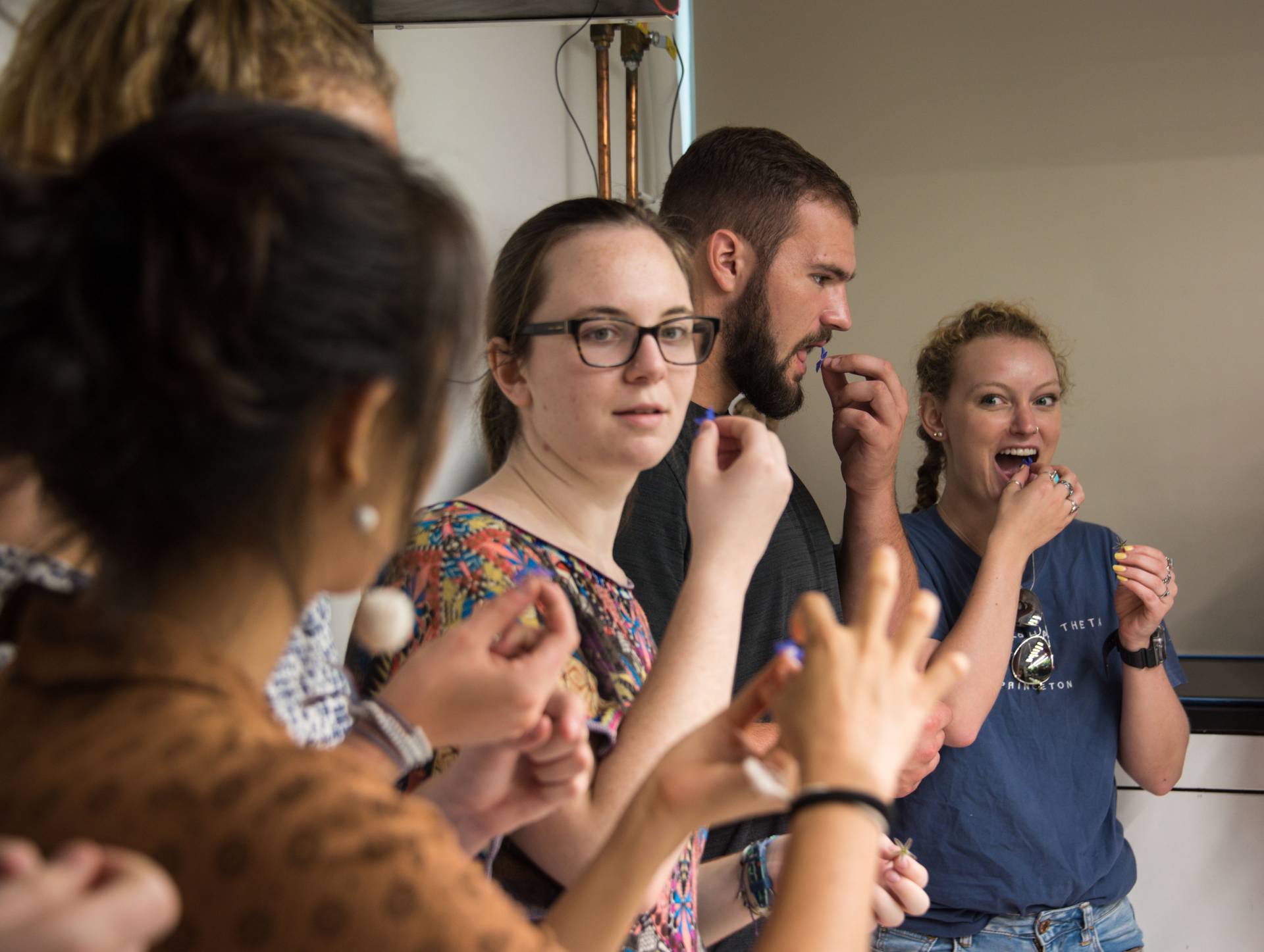 Students eating edible flower