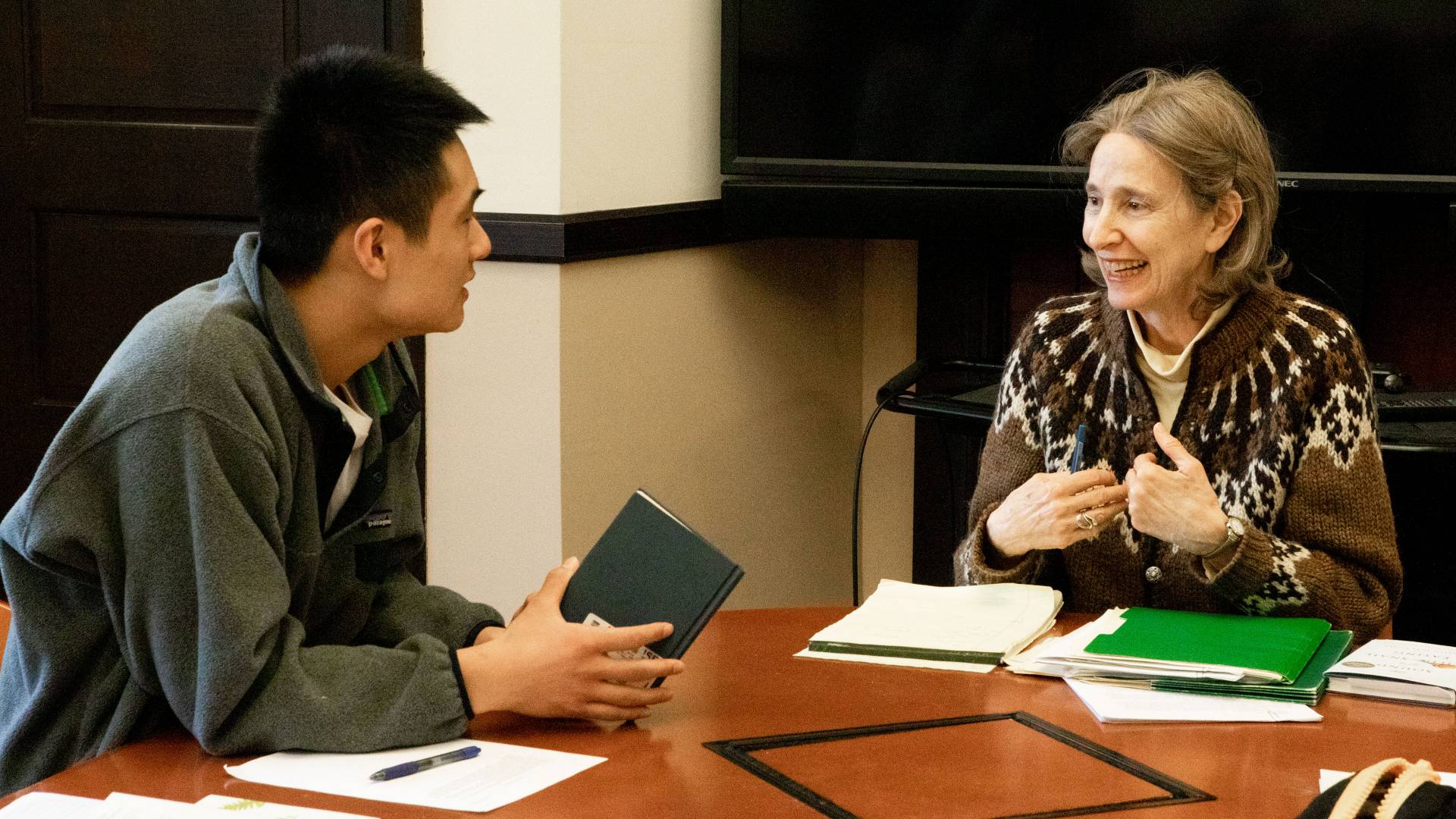 Professor Chances speaking with student during class