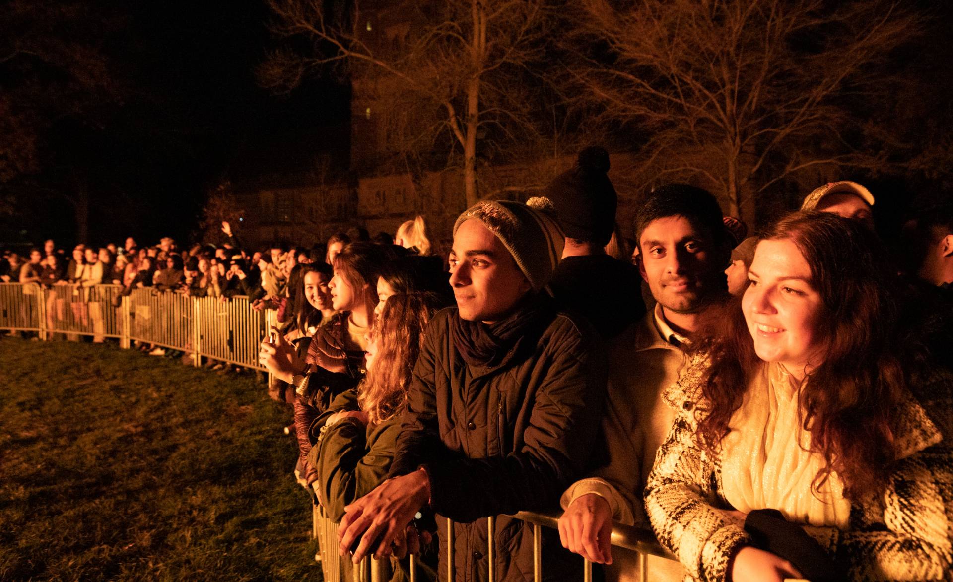 Students looking on at the bonfire
