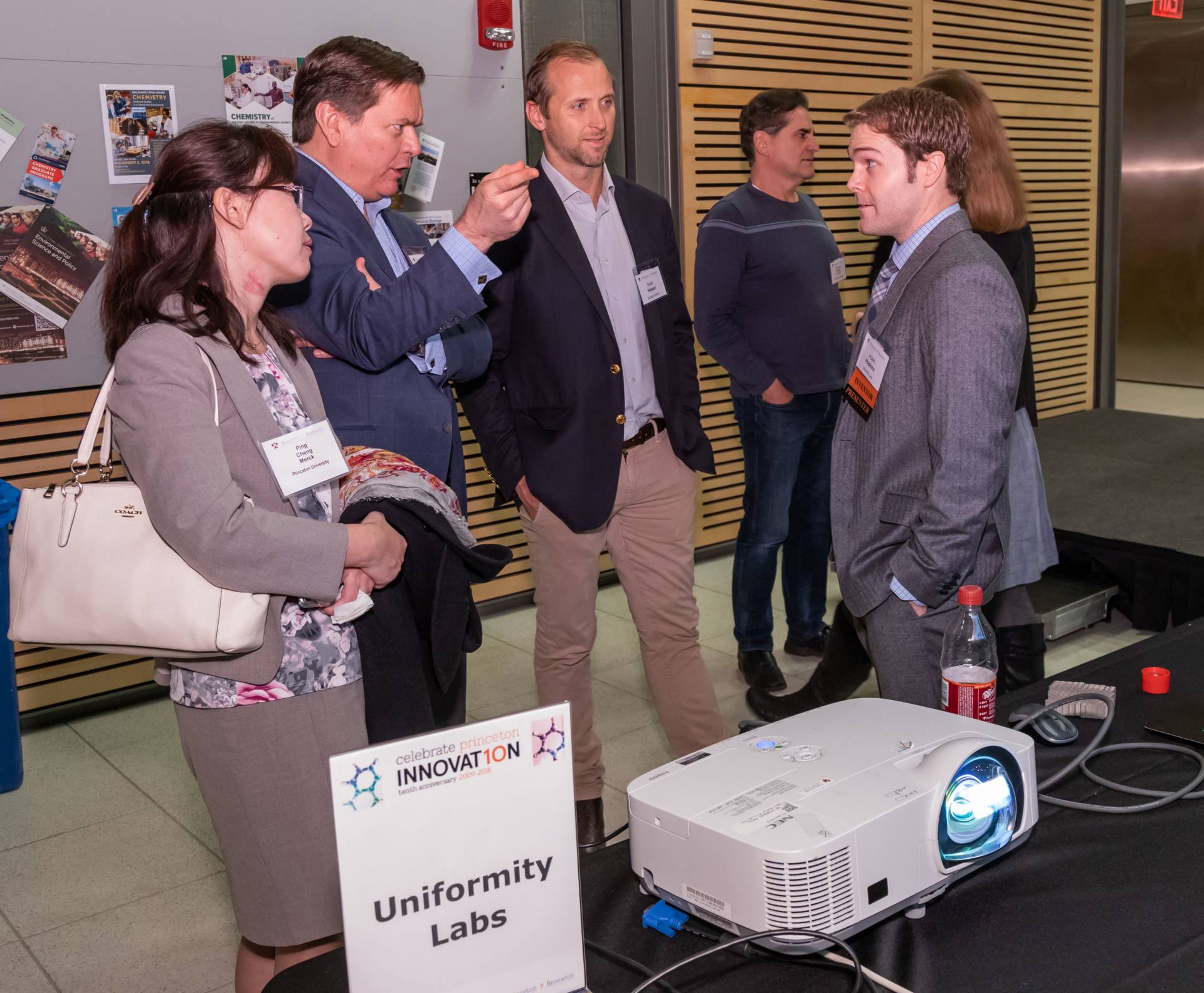 Adam Hopkins speaking to people about his startup