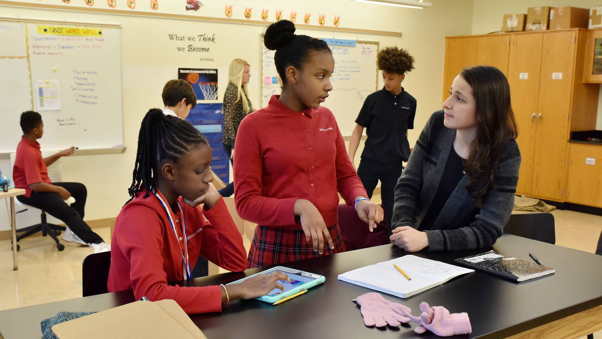 Student engaging with 2 students at Seix Academy