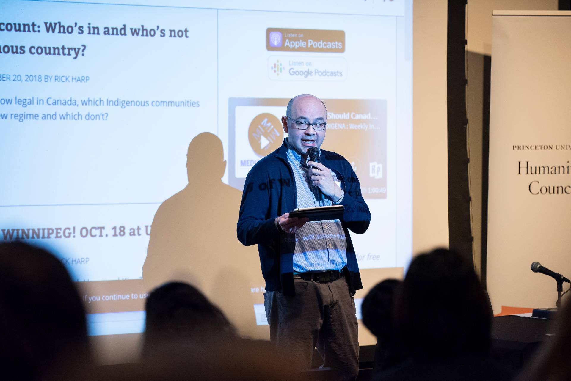 Rick Harp talks in front of an audience