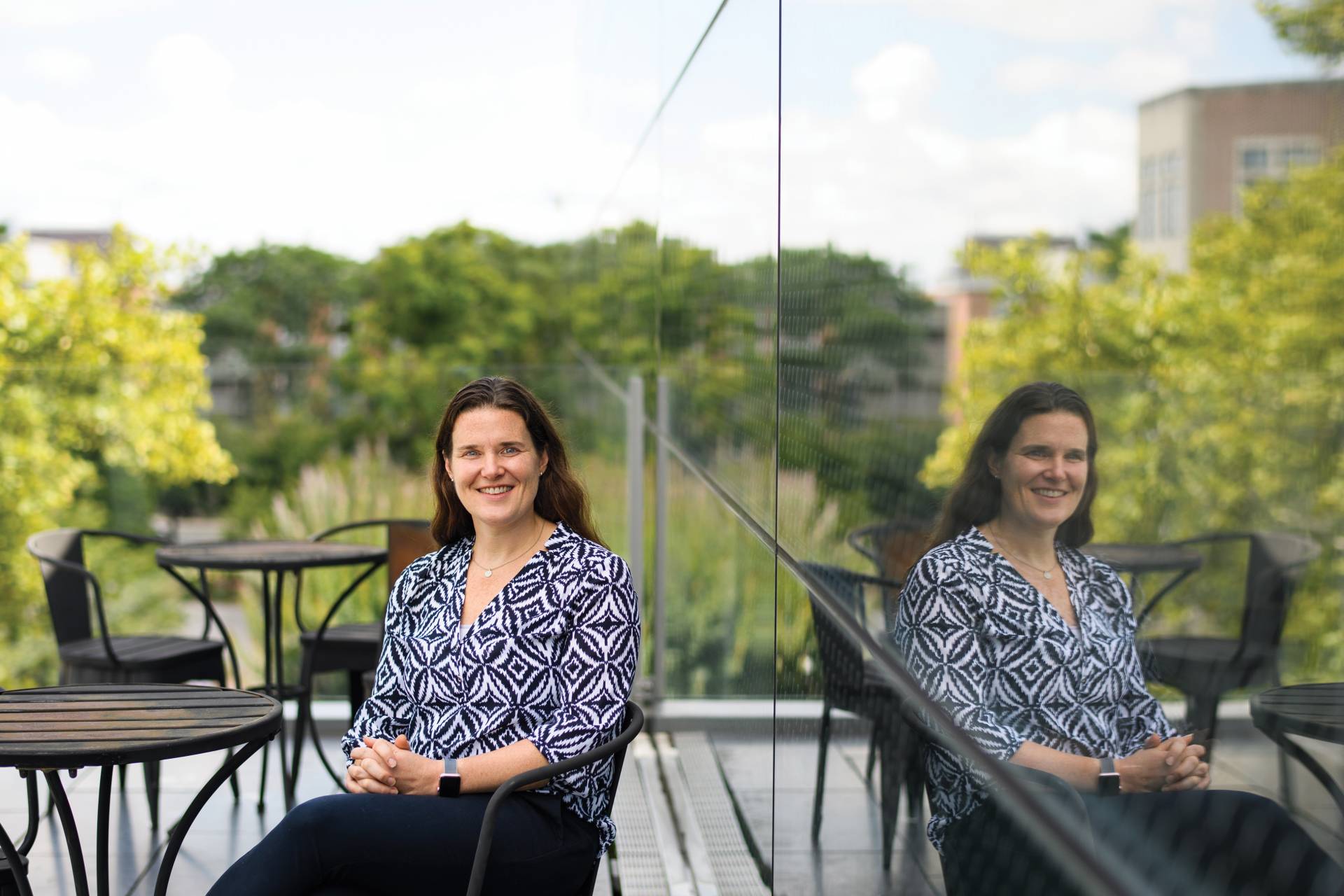 Barbara Engelhardt sits in front of her reflection