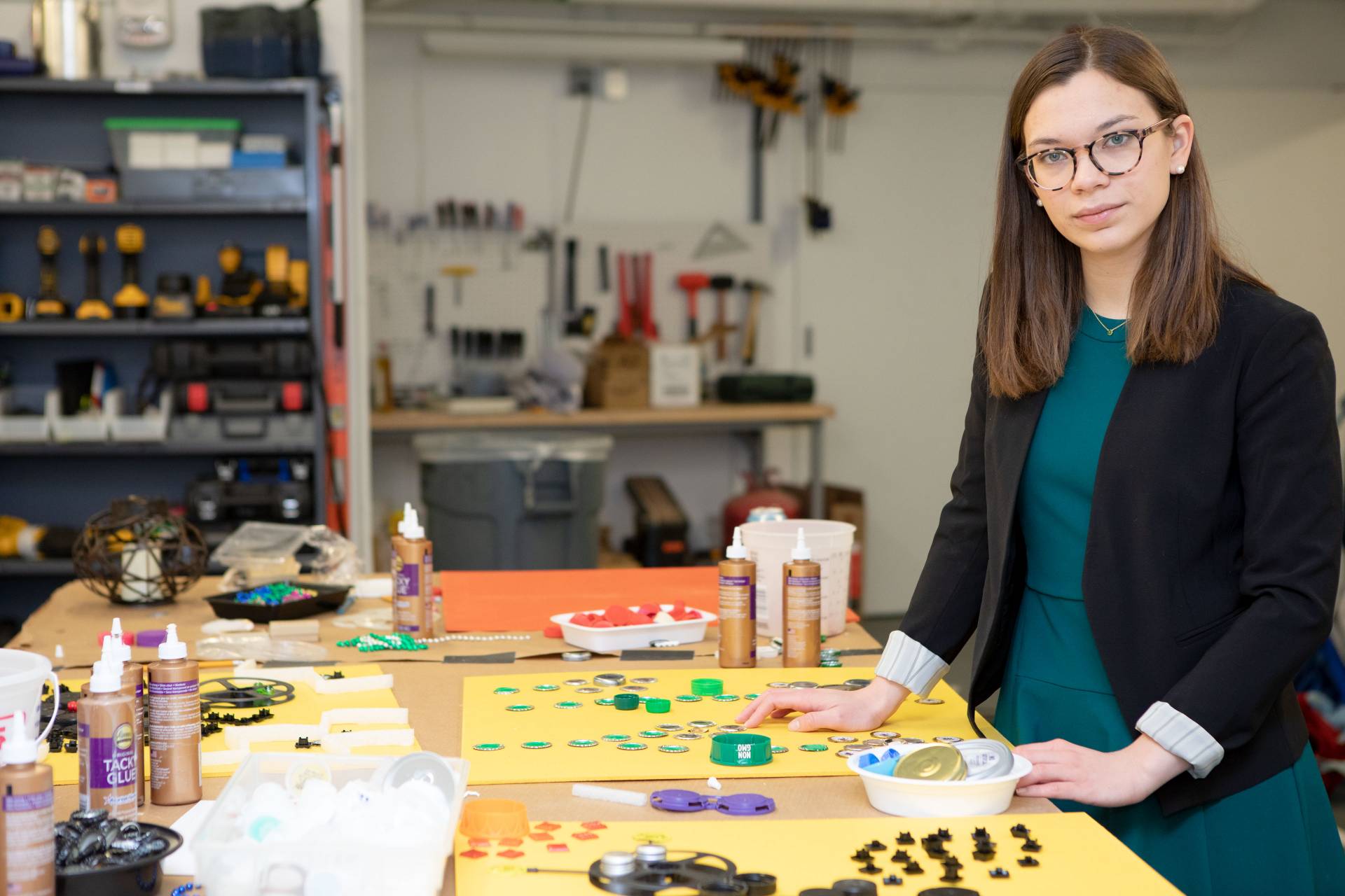 Annabel Barry standing at table with art supplies