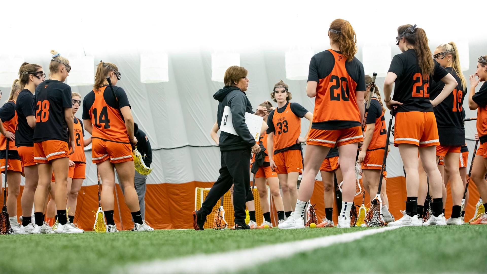 Coach Sailer speaking to women's lacrosse team