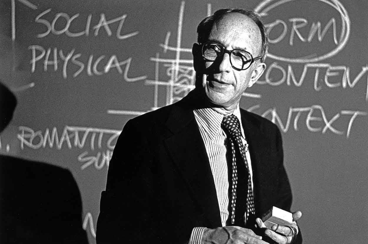 Robert Geddes in front of a blackboard