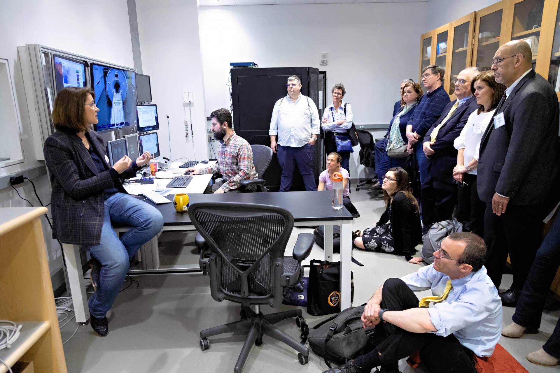 Sabine Kastnerspeaks to a group of visitors to her lab