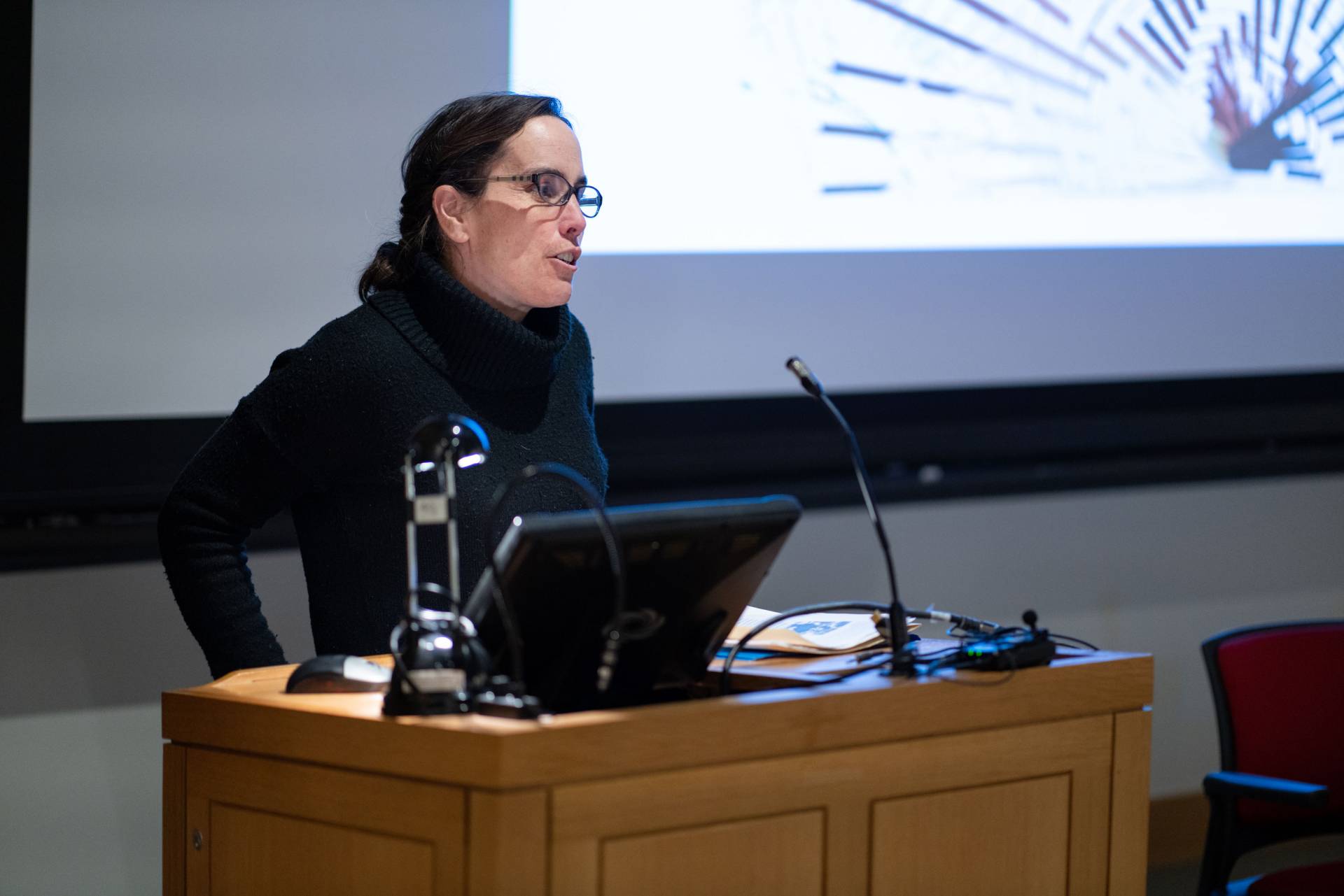 Wendy Warren speaking at podium