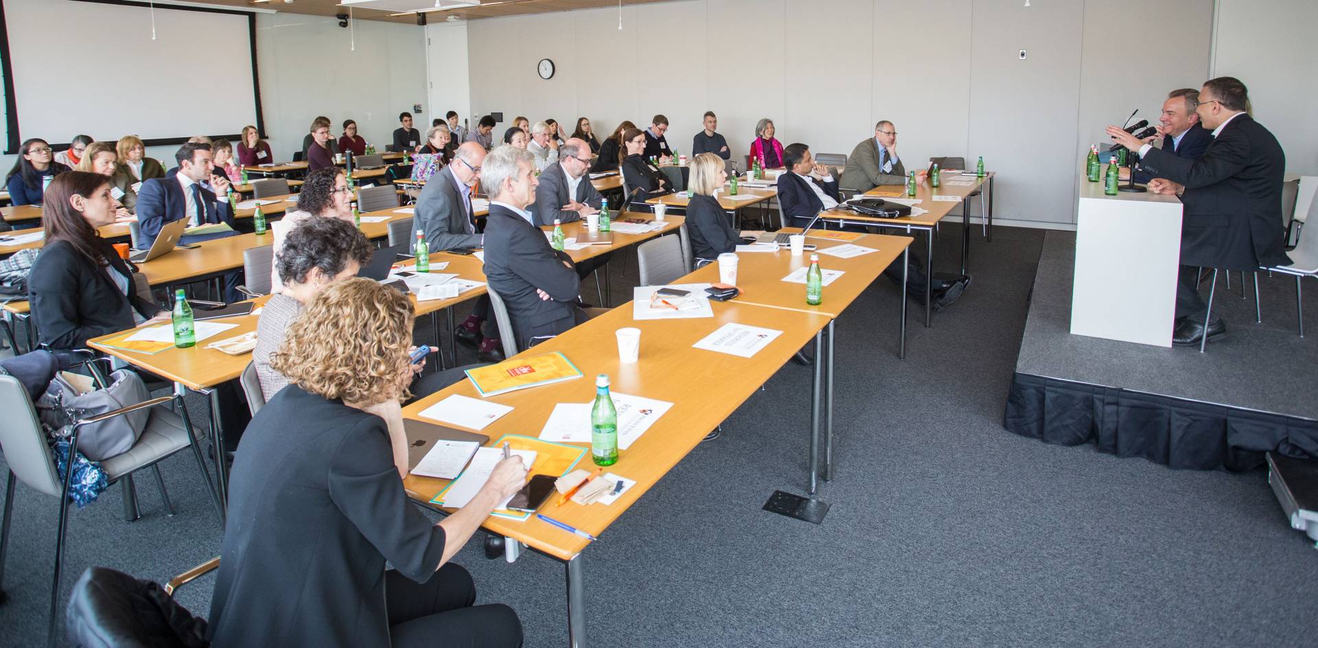 The audience listens to a panel discussion