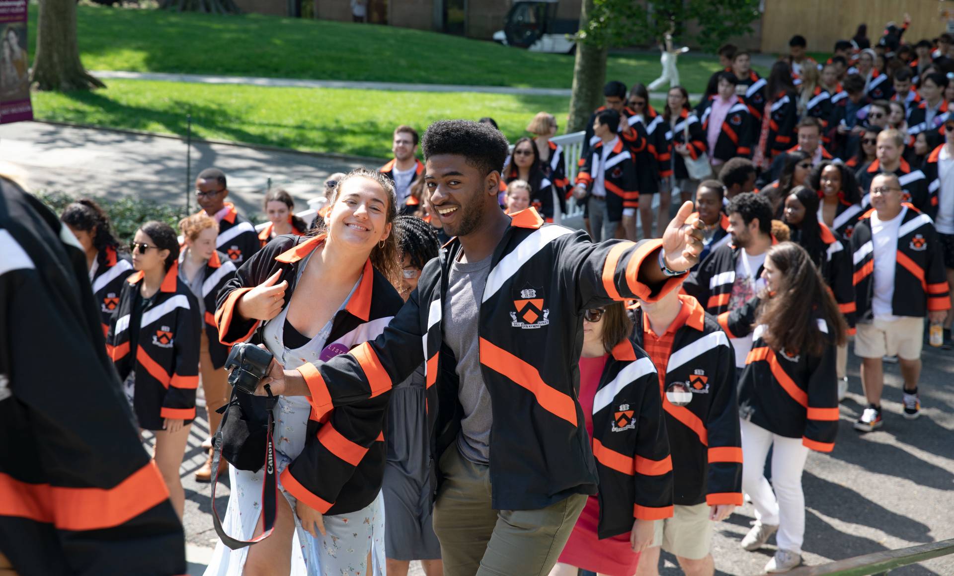 Happy seniors show off jackets
