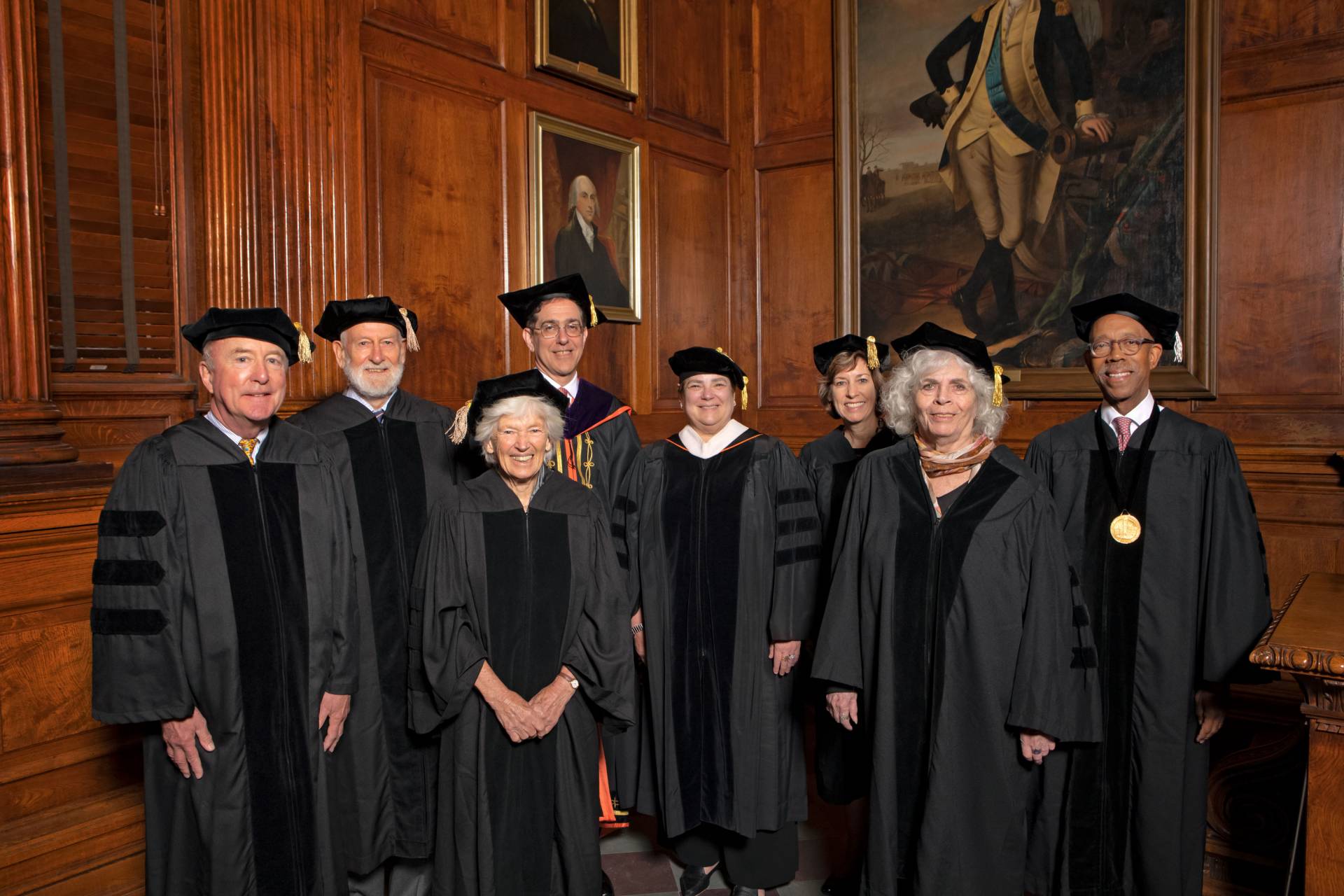 Recipients of honorary degrees pose in their ceremonial robes and mortarboards