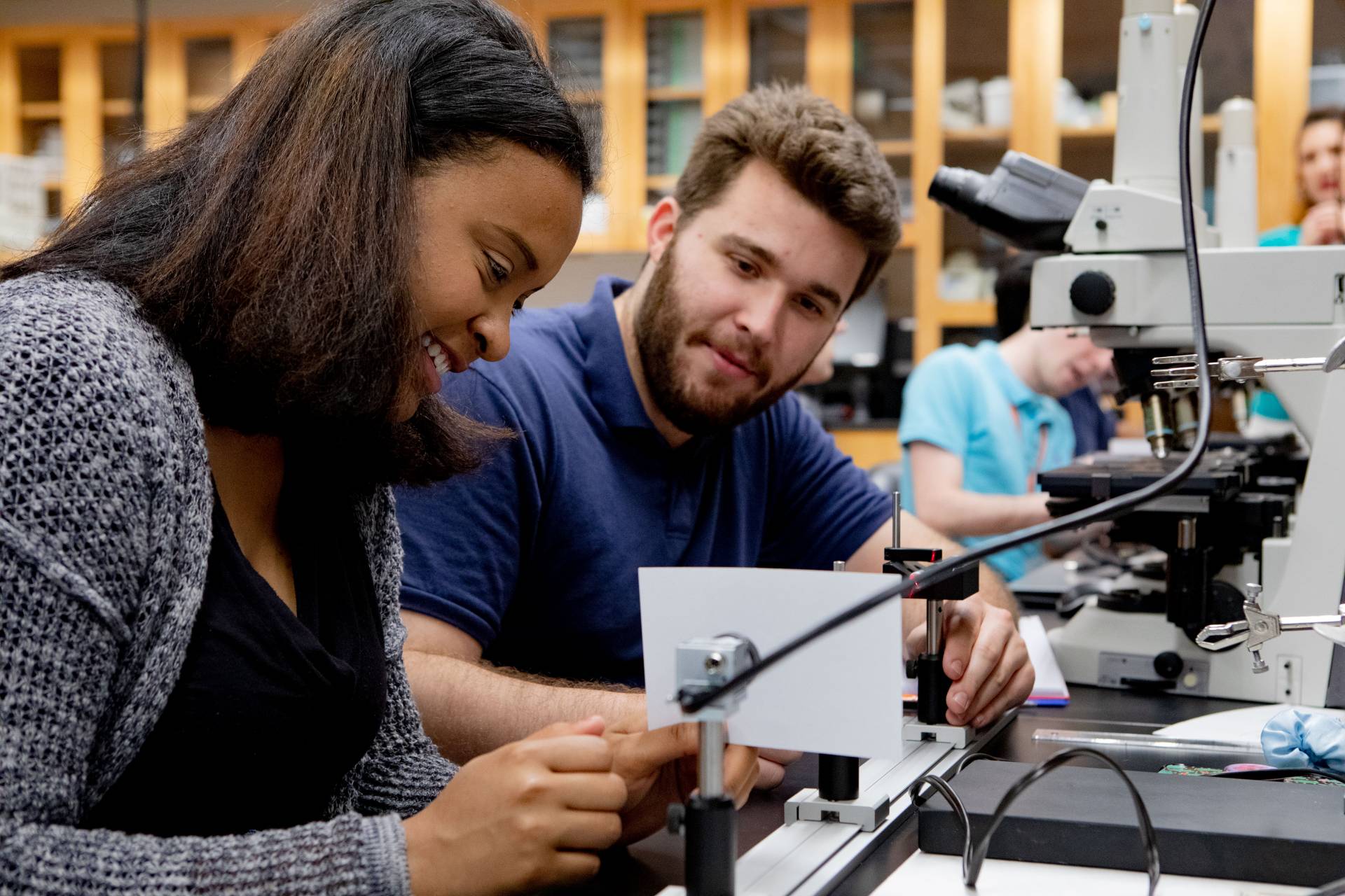 Two students work on a science project